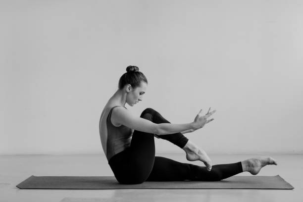 istock Young beautiful yoga woman is posing in studio. 1284439057