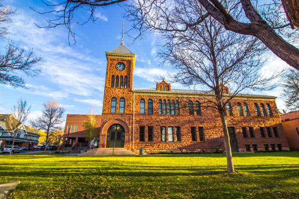 istock Stone Exterior Of Public Building With Clock Tower 1284439460