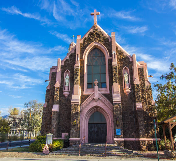 istock Old Corner Church With Stained Glass Front Window 1284440299