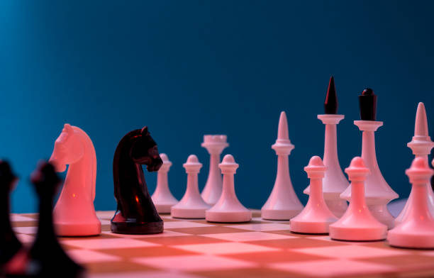 istock Chess Pieces standing on the Chessboard before the tournament. 1284440488