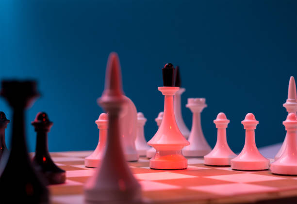 istock Chess Pieces standing on the Chessboard before the tournament. 1284440494