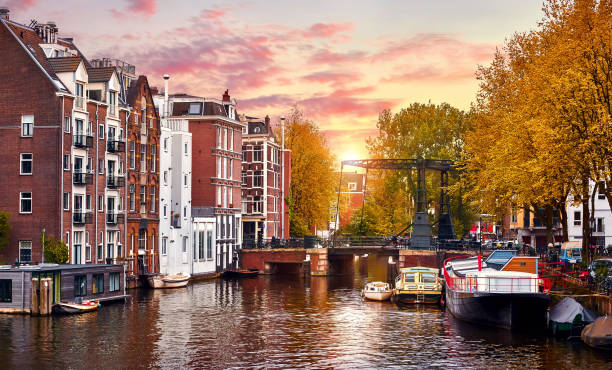 istock Amsterdam, Netherlands. Autumn sunset scene with scenic channels 1284440901