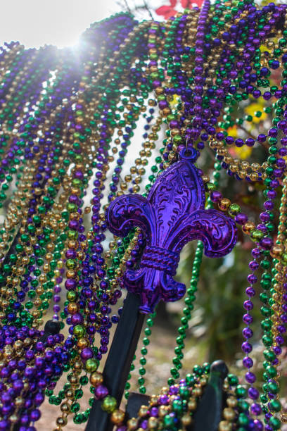 istock Mardi Gras beads covering wrought iron fence 1284444495