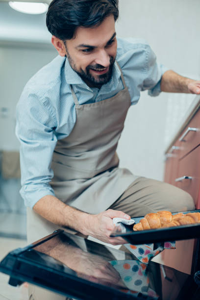 istock Excited man enjoying the process of making pastry 1284445507