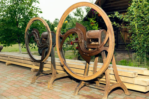 istock Two old feed choppers stand in the yard 1284446790