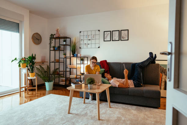 istock Couple at home during coronavirus pandemic, working on laptop 1284448203
