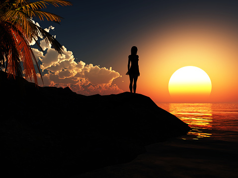 Silhouette of a young girl at sunset