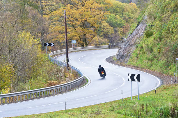 istock Motorcycle on dangerous bend in rural countryside 1284449418