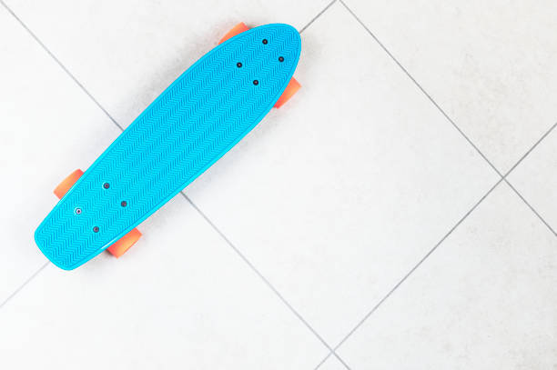 istock Skateboard cruiser style blue yellow and orange view from above 1284450210