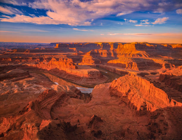 Eroded red rock formations Canyonlands NP. Utah DARMATIC DUSK LANDSCAPE AT THE GOOSE NECK FROM DEAD HORSE STATE PARK canyonlands national park stock pictures, royalty-free photos & images