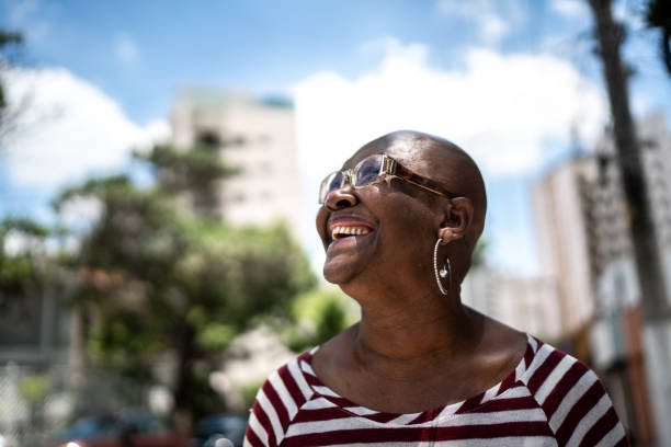 istock Happy senior woman outdoors looking away 1284454386