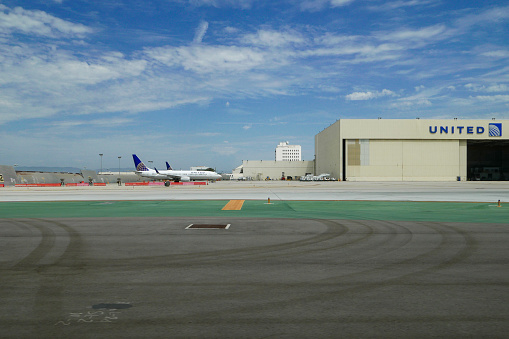 Antalya, Turkey - May 27, 2007: VIP shuttle service van on airport platform waiting beside a jumbo jet.