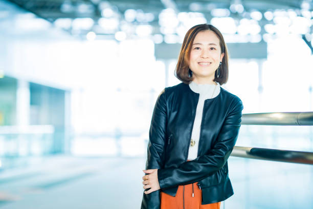 istock Casually dressed asian business woman 1284455324