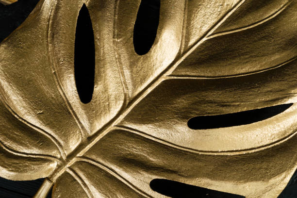 istock Golden tropial leaves 1284456565