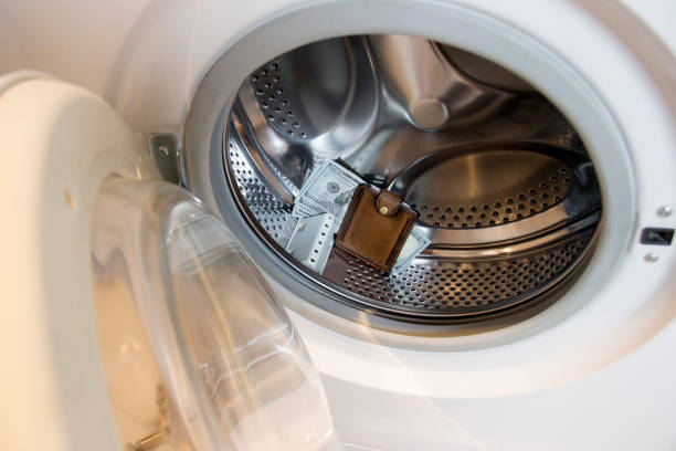 istock A wallet with money is in the washing machine. 1284458486