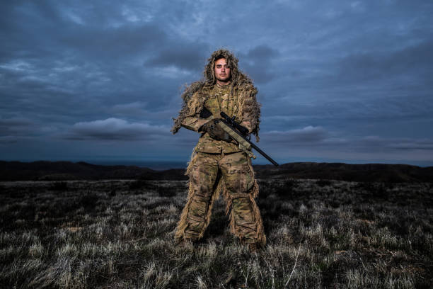 istock Army Soldier Sniper in Gillie Suit 1284459501