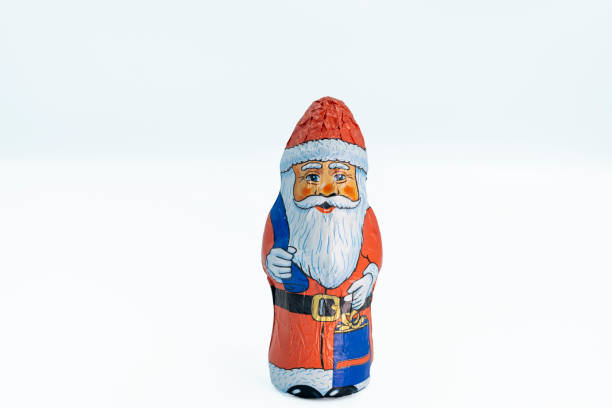 Santa Claus, macro shot, Christmas time santa claus figure and Christmas decorations on a white background