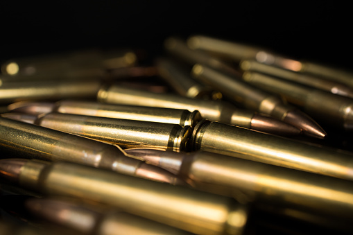 pile of .223 5.56x45 rifle bullets. Automatic rifle ammunition.