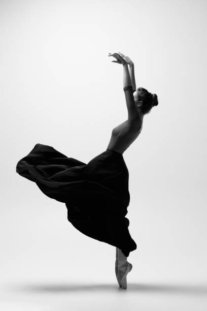 istock Young beautiful ballerina is posing in studio 1284461761