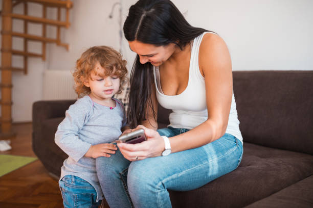 istock Best fun for a kid with a mobile phone 1284462250