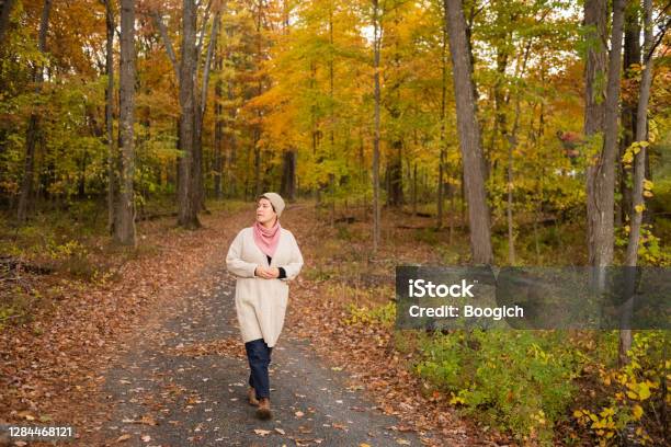 Non Binary Person Walking Autumn Country Road In Upstate New York Stock Photo - Download Image Now