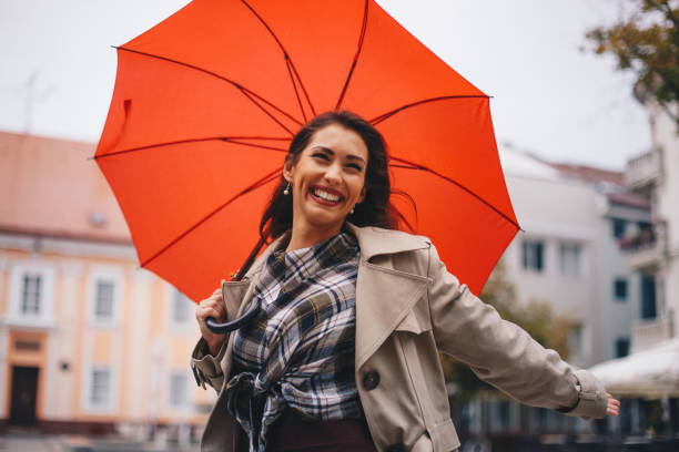 istock Lovely woman is walking on rainy day. 1284468819