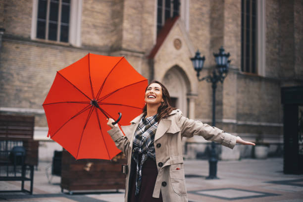 istock Hipster girl is happy because rain stopped. 1284468845