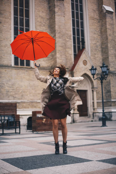 istock Young woman is enjoying windy Autumn day. 1284468855