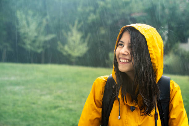 istock Happy young girl having fun under the rain 1284472408