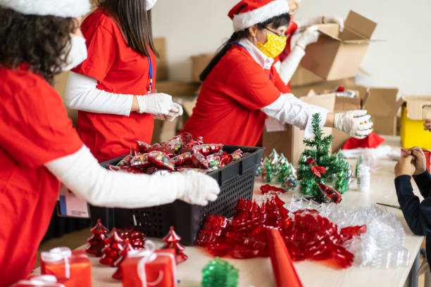 istock Volunteers packing Christmas gifts 1284472741