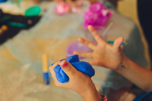 istock Ingredient for make home made Toy Called Slime, Teenager having fun and being creative homemade slime. Selective focus on Slime. 1284472971