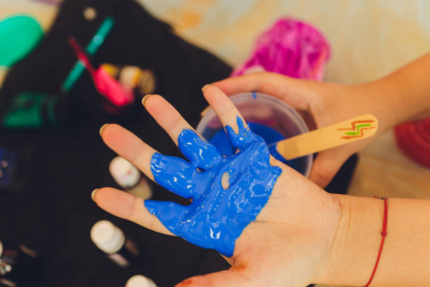 istock Ingredient for make home made Toy Called Slime, Teenager having fun and being creative homemade slime. Selective focus on Slime. 1284472974