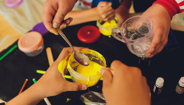 istock Ingredient for make home made Toy Called Slime, Teenager having fun and being creative homemade slime. Selective focus on Slime. 1284472978
