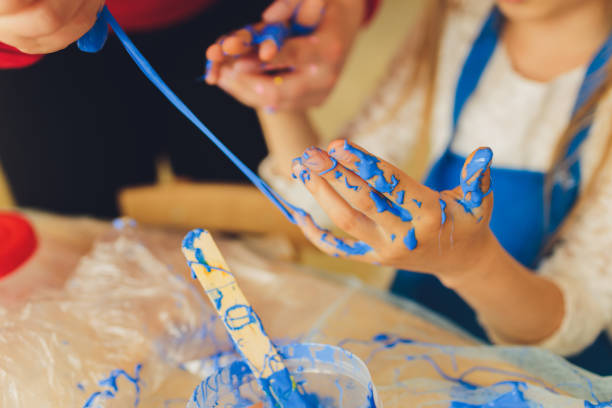 istock Ingredient for make home made Toy Called Slime, Teenager having fun and being creative homemade slime. Selective focus on Slime. 1284472979