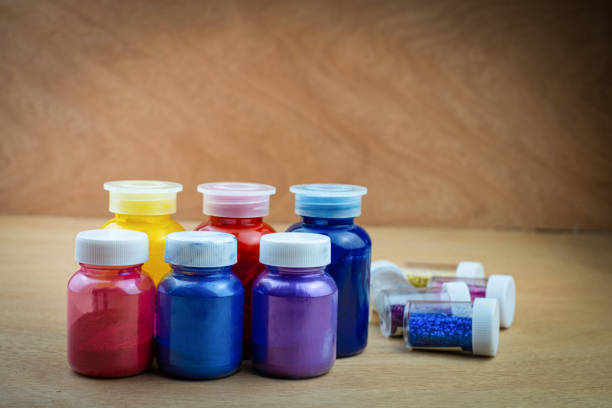 istock Mixing color epoxy resin in a plastic cup for casting stabilizing wood 1284475688