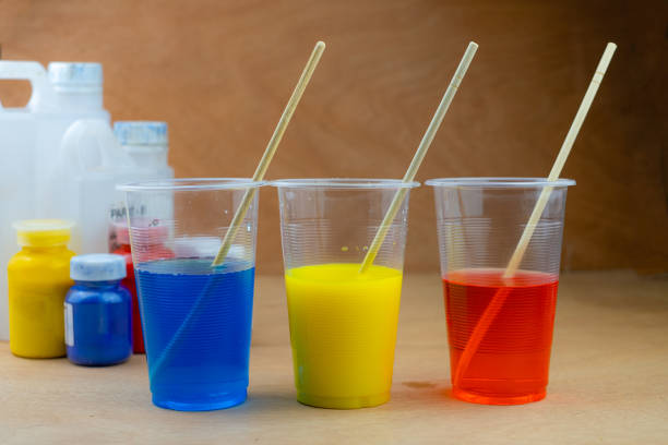 istock Mixing color epoxy resin in a plastic cup for casting stabilizing wood 1284475698