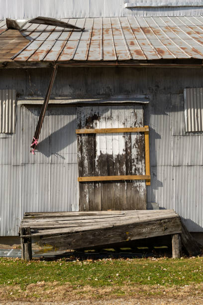 istock Closed and shuttered old industrial building. 1284475755