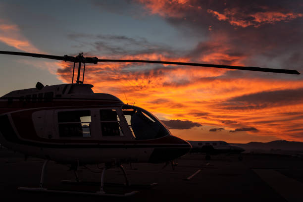 Helicopter in Silhouette at Sunset.  Bishop, California, USA stock photo
