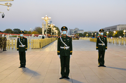 Beijing, China- November 7, 2020: In the heart of Beijing-the politics center of China, there is a national flag lowering ceremony everyday in Tian'an Square. It attracks many tourists from all over the country. Here are the armed police guards in charge of the order for the ceremony.