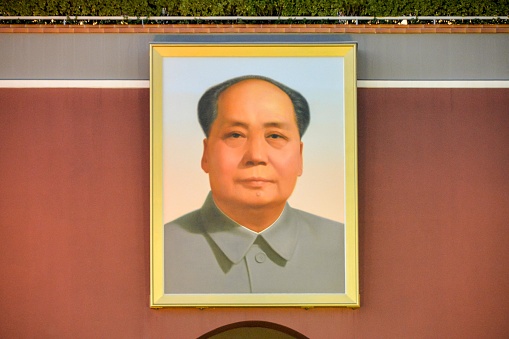 Beijing, China- November 7, 2020: The Tiananmen Square is the geographic center of Beijing and the heart of China.  Here is the huge portrait of Chairman Mao.