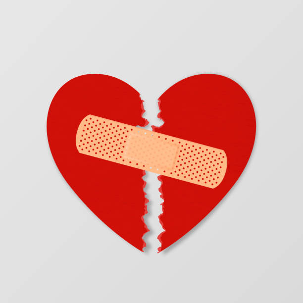 istock Vector Realistic Paper Textured Torn Heart with Medical Patch Closeup Isolated on White Background. Broken Heart, Divorce, Valentines Day, Relationship Concept. Paper Art 1284481387