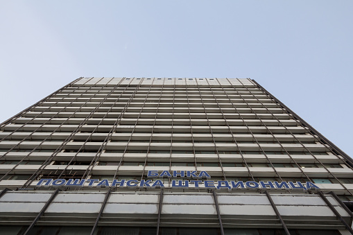 Picture of a  sign with the Banka Postanska Stedionica on their bank headquarters office in a street of Belgrade. Banka Postanska stedionica is one of the largest operating banks in Serbia, mainly owned by the Government of Serbia