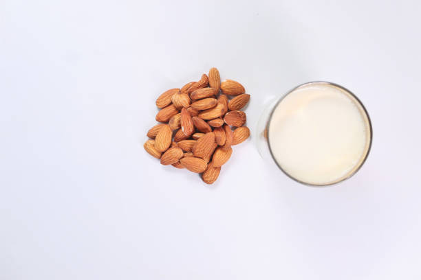 istock almond nut and milk on table top down 1284490212