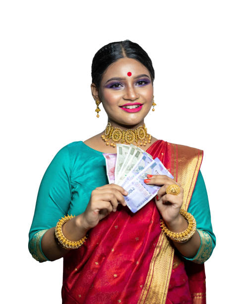 istock Beautiful Young woman holding Indian rupee notes 1284491748