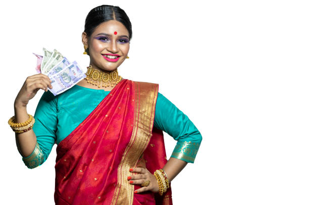 istock Beautiful Young woman holding Indian rupee notes 1284491749