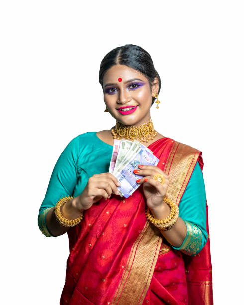 istock Beautiful Young woman holding Indian rupee notes 1284491752
