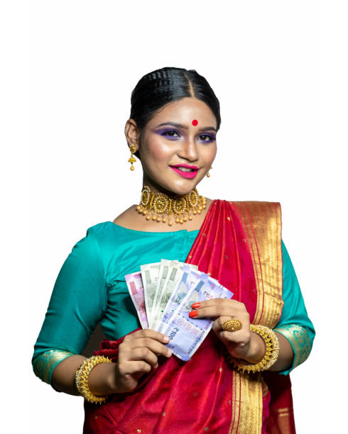 istock Beautiful Young woman holding Indian rupee notes 1284491756