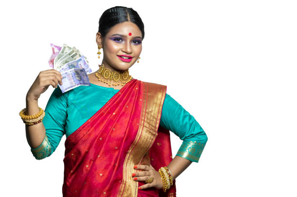 istock Beautiful Young woman holding Indian rupee notes 1284491763
