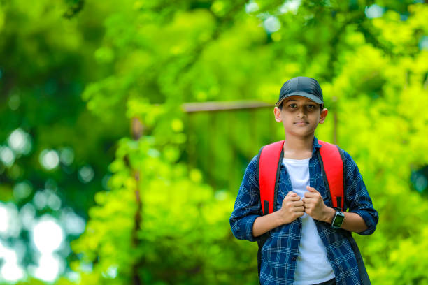 istock Indian cute schoolboy with backpack, Back to school concept 1284499392