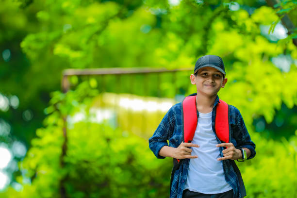 istock Indian cute schoolboy with backpack, Back to school concept 1284499972